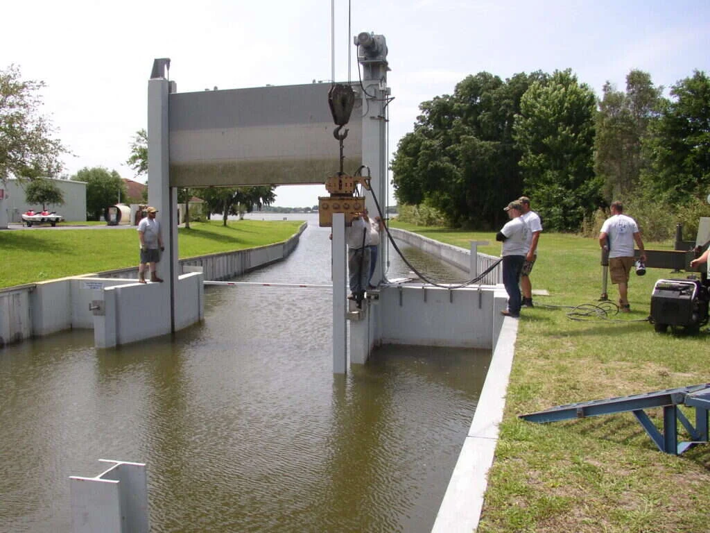 District crew servicing a lock gate with a hoist